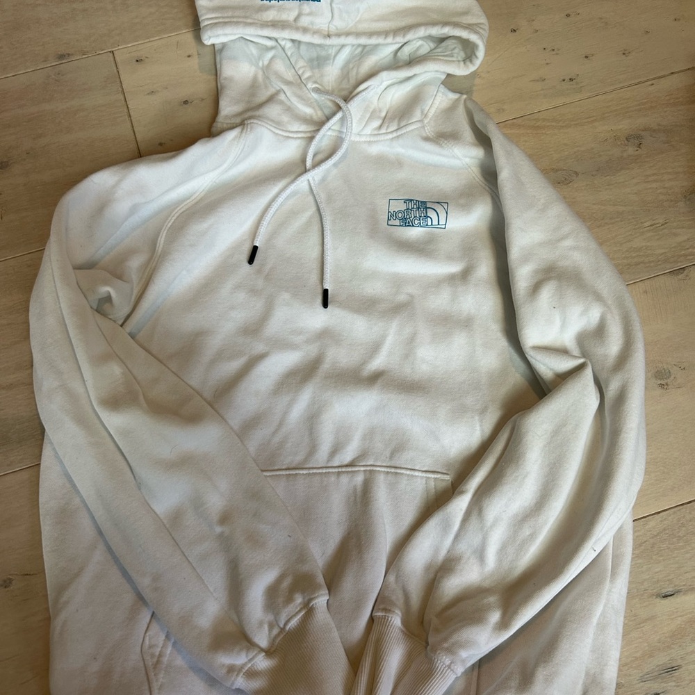 The North Face white and colorful sweatshirt